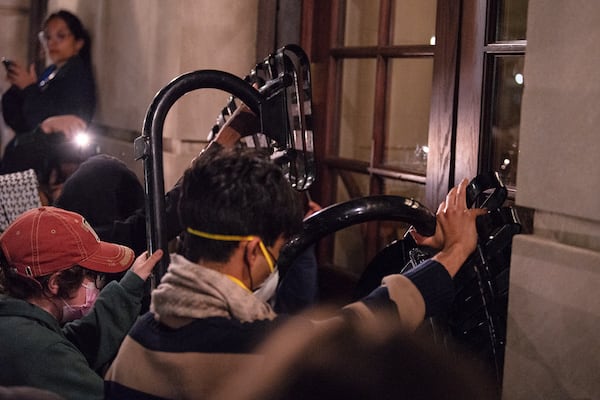 FILE - Students with the Gaza solidarity encampment block the entrance of Hamilton Hall at Columbia University after taking over it on Tuesday, April 30, 2024 in New York. Columbia Students for Justice in Palestine called for mobilization close to midnight. (Marco Postigo Storel via AP, file)
