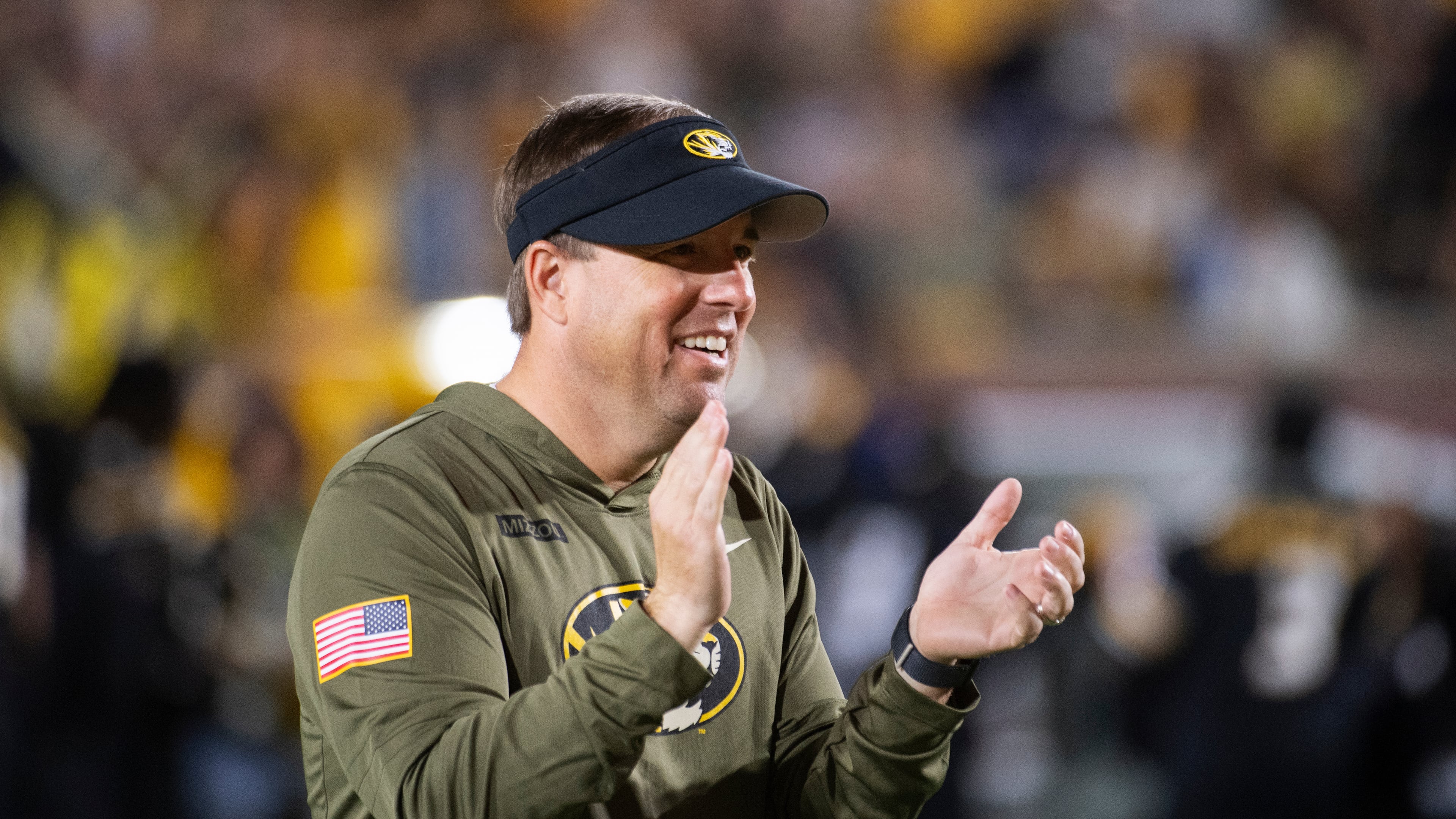 Missouri head coach Eli Drinkwitz claps during the first half of an NCAA college football game against Mississippi State, Saturday, Nov. 15, 2025, in Columbia, Mo. (AP Photo/L.G. Patterson)