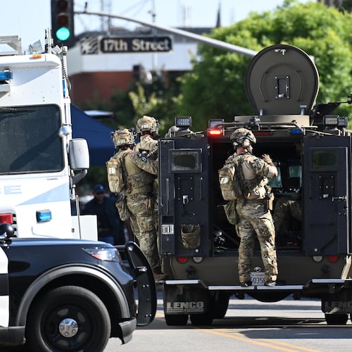 FBI agents respond after a man barricaded himself inside a building with hostages Tuesday, June 2, 2026, in Bakersfield, Calif. (AP Photo/David Dennis)