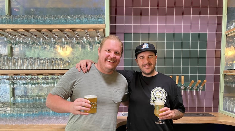 Brewers and owners Josh Johnson and Rhett Caseman are shown in the taproom at the new Inner Voice Brewing in Decatur. (Bob Townsend for The Atlanta Journal-Constitution)