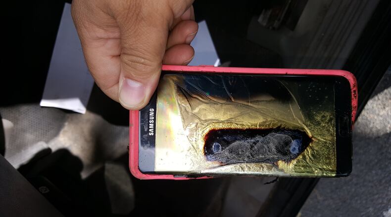 Andrew Zuis, of Farmington, Minn., took this photo showing a replacement Samsung Galaxy Note 7 phone that he said melted in the hands of his 13-year-old daughter. Concerns about batteries in personal devices causing fires is prompting some airlines to add “fire containment” bags. (Andrew Zuis via AP)