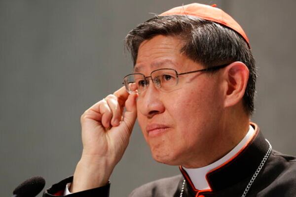 FILE - President of Caritas Internationalis Cardinal Luis Antonio Gokim Tagle makes a point during a press conference announcing the launch of a campaign on the plight of migrants to counteract mounting anti-immigrant sentiment in the U.S., Europe and beyond, at the Vatican press center, Wednesday, Sept. 27, 2017. (AP Photo/Andrew Medichini, File)