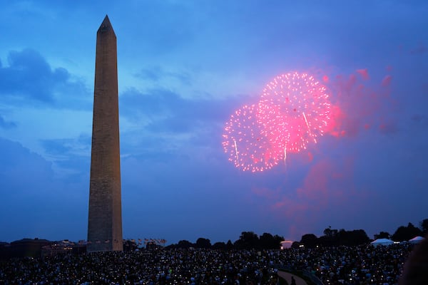 People watch fireworks at the end of a military parade commemorating the Army's 250th anniversary Saturday, June 14, 2025, in Washington. (AP Photo/Julia Demaree Nikhinson)