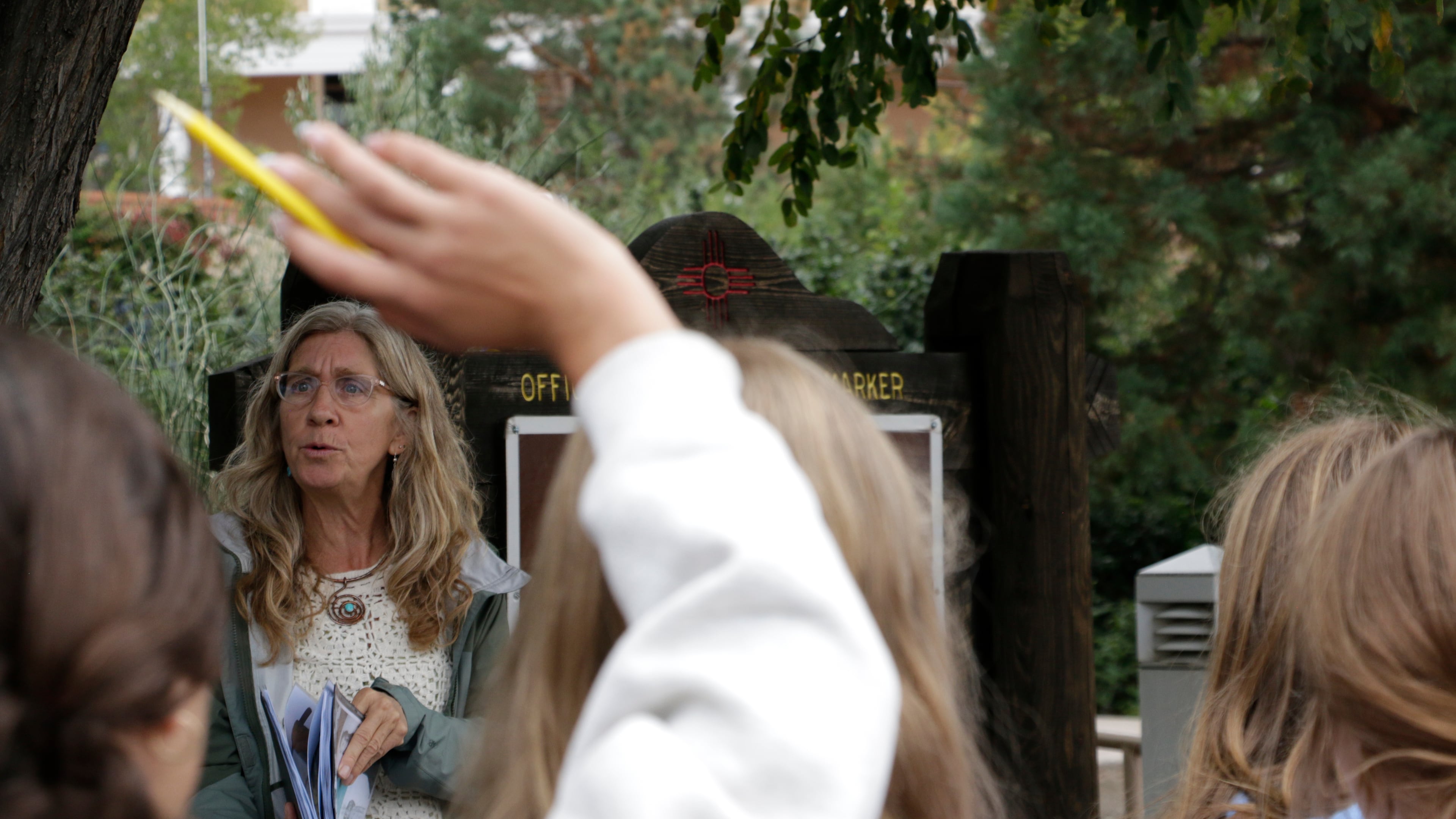 Lisa Nordstrum, a history teacher at Santa Fe Preparatory School, asks questions during a field trip with her seventh-grade history class Wednesday, Oct. 8, 2025, in Santa Fe, N.M. (AP Photo/Stacy Thacker)