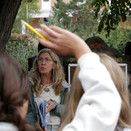 Lisa Nordstrum, a history teacher at Santa Fe Preparatory School, asks questions during a field trip with her seventh-grade history class Wednesday, Oct. 8, 2025, in Santa Fe, N.M. (AP Photo/Stacy Thacker)