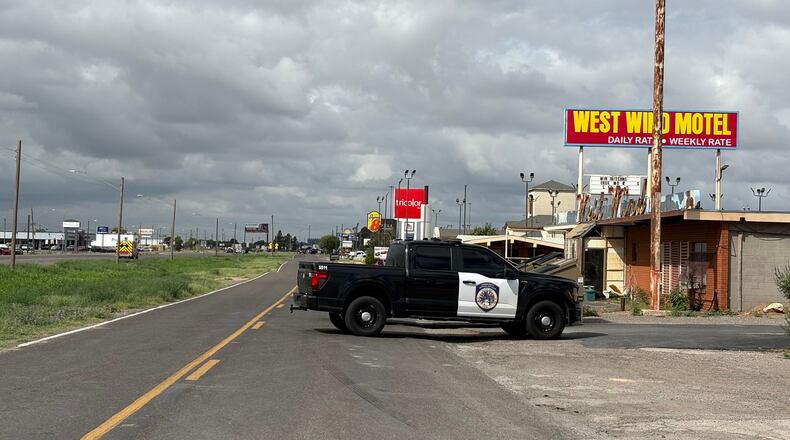 Law enforcement responds to an active shooting scene Friday, June 12, 2026, in Midland, Texas. (Luke Dias/Reporter-Telegram via AP)