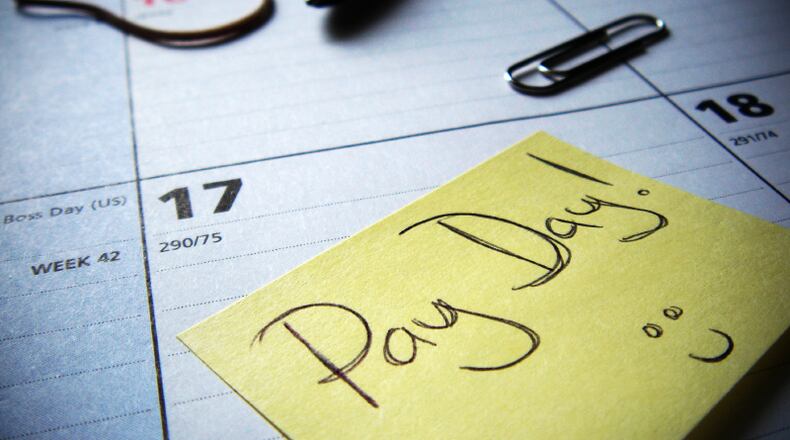 Teachers and staff with Douglas County Schools will now be paid twice a month.