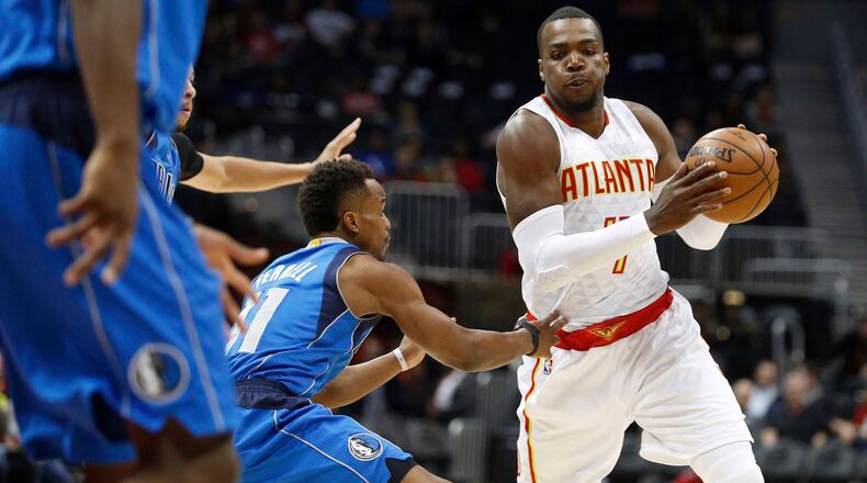 Atlanta Hawks forward Paul Millsap (4) drives with the ball while Dallas Mavericks guard Yogi Ferrell (11) defends during the first half of an NBA basketball game, Wednesday, March 1, 2017, in Atlanta. (AP Photo/AJ Reynolds)