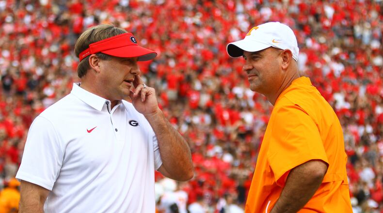 Georgia head coach Kirby Smart catches up with Tennessee head coach Jeremy Pruitt before an NCAA football game between the University of Georgia Bulldogs and the University of Tennessee Volunteers in Sanford Stadium in Athens, Ga., on Saturday, Sept., 29, 2018. (Photo by Kristin M. Bradshaw)