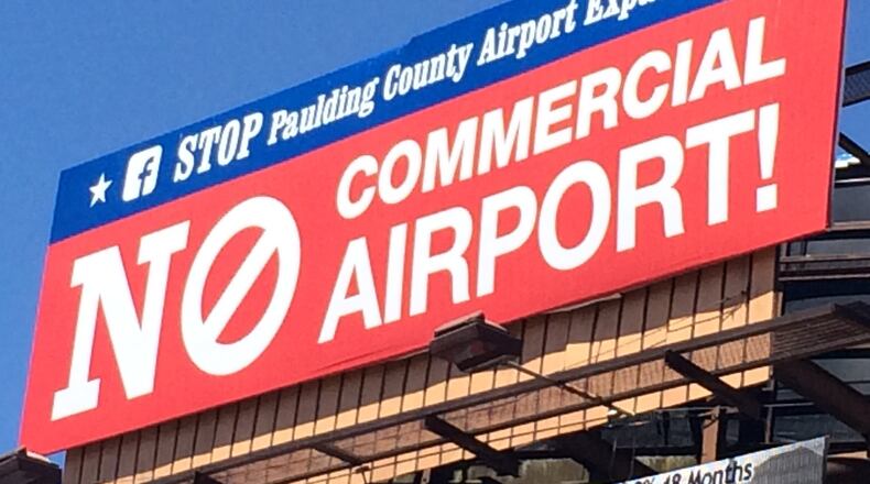 Anti-airport commercialization billboards have gone up in Paulding County.