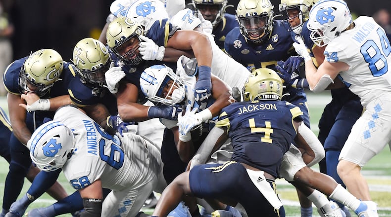 September 25, 2021 Atlanta - North Carolina's running back Ty Chandler (19) is brought down by Georgia TechÕs defense during the second half of an NCAA college football game at Mercedes-Benz Stadium in Atlanta on Saturday, September 25, 2021. Georgia Tech won 45-22 over North Carolina. (Hyosub Shin / Hyosub.Shin@ajc.com)