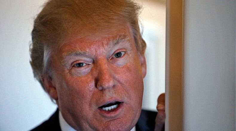 In this April 6, 2017, photo, President Donald Trump speaks with reporters on Air Force One while in flight from Andrews Air Force Base, Md., to Palm Beach International Airport, Fla. Trump has scrapped the tax plan he campaigned on and is going back to the drawing board in a search for Republican consensus behind legislation to overhaul the U.S. tax code. The effort, the administration's first attempt to write legislation, is in its early stages and the White House has kept much of it under wraps. But it has already sprouted the consideration of a series of unorthodox proposals including a drastic cut to the payroll tax, aimed at appealing to Democrats.