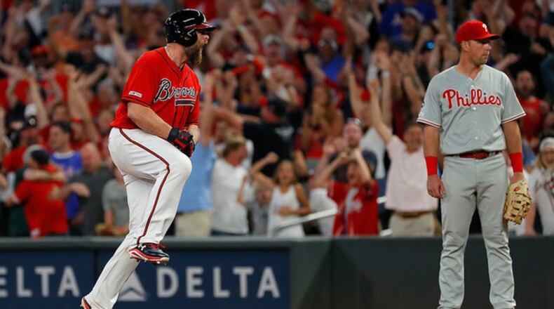 <p>Brian McCann #16 of the Atlanta Braves reacts after hitting a walk-off single to score two runs to give the Braves a 9-8 win over the Philadelphia Phillies at SunTrust Park on June 14, 2019 in Atlanta, Georgia. (Photo by Kevin C. Cox/Getty Images)</p> <p>Brian McCann #16 of the Atlanta Braves reacts after hitting a walk-off single to score two runs to give the Braves a 9-8 win over the Philadelphia Phillies at SunTrust Park on June 14, 2019 in Atlanta, Georgia. (Photo by Kevin C. Cox/Getty Images)</p> <p> Atlanta Braves' Brian McCann (16) is doused by teammates after driving in the winning run with a two-run single during the ninth inning of the team's baseball game against the Philadelphia Phillies on Friday, June 14, 2019, in Atlanta. The Braves won 9-8. (AP Photo/John Bazemore) </p> <p> Atlanta Braves mob Brian McCann after he hit a two-run single in the ninth inning of a baseball game to defeat Philadelphia Phillies 9-8 Friday, June 14, 2019, in Atlanta. (AP Photo/John Bazemore) </p> <p>ATLANTA, GEORGIA - JUNE 14: Austin Riley #27 of the Atlanta Braves reacts after hitting a RBI double in the ninth inning against the Philadelphia Phillies at SunTrust Park on June 14, 2019 in Atlanta, Georgia. (Photo by Kevin C. Cox/Getty Images)</p> <p> Atlanta Braves' Nick Markakis (22) beats the tag from Philadelphia Phillies catcher J.T. Realmuto (10) to score on an Ozie Albies base hit during the eighth inning of a baseball game Friday, June 14, 2019, in Atlanta. (AP Photo/John Bazemore) </p> <p> Atlanta Braves' Austin Riley slides, but is tagged out by Philadelphia Phillies second baseman Sean Rodriguez as he tried to steal second base during the fourth inning of a baseball game Friday, June 14, 2019, in Atlanta. (AP Photo/John Bazemore) </p>