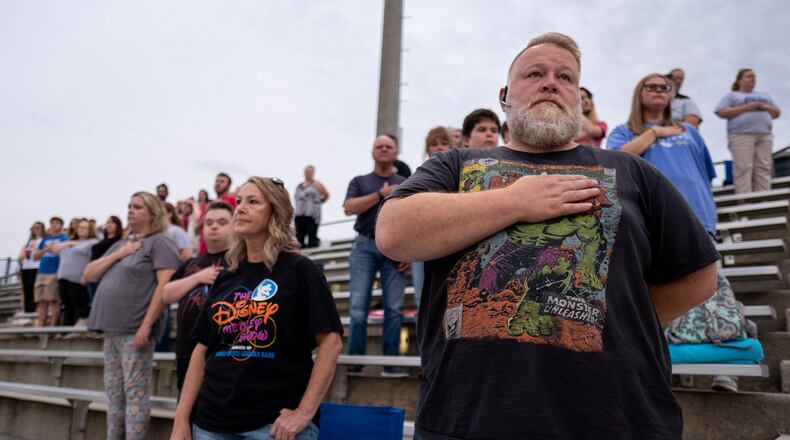 200918-Homer-James Luthi stands for the National Anthem before the beginning of the Banks County vs. East Jackson high school football game on Friday night Sept. 18, 2020 in Homer, Ga. Luthi, whose son is the drum major for the Banks County High School band, said he voted for Donald Trump four years ago and this year he is “the only option.” Ben Gray for the Atlanta Journal-Constitution