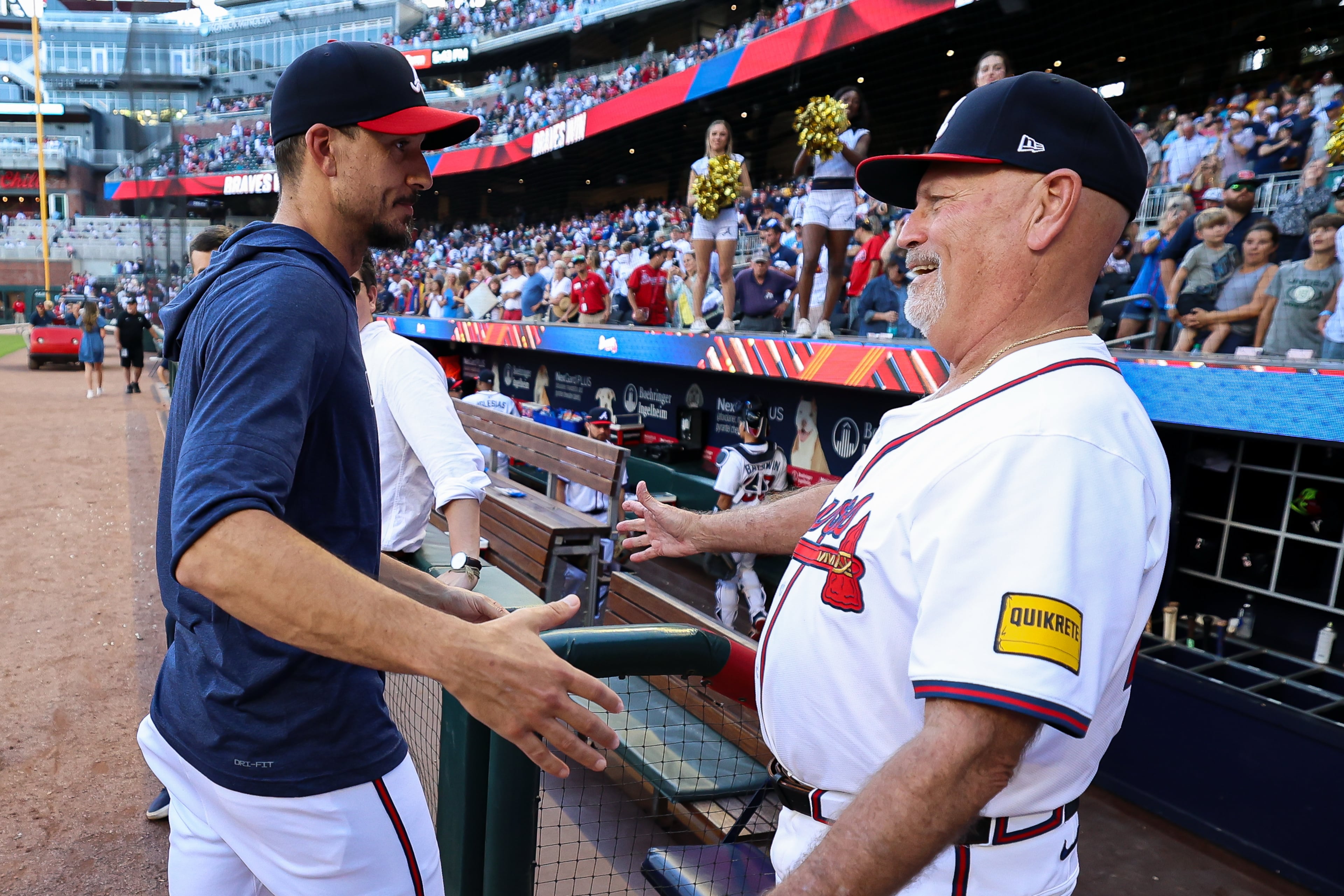 Charlie Morton (left) offers a postgame hug to Braves manager Brian Snitker.