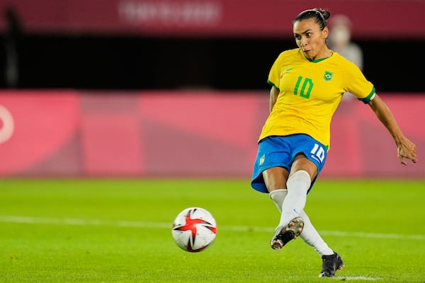 FILE - Brazil's Marta takes a penalty shot during a shootout in a women's quarterfinal soccer match against Canada at the 2020 Summer Olympics, Friday, July 30, 2021, in Rifu, Japan. (AP Photo/Andre Penner, File)