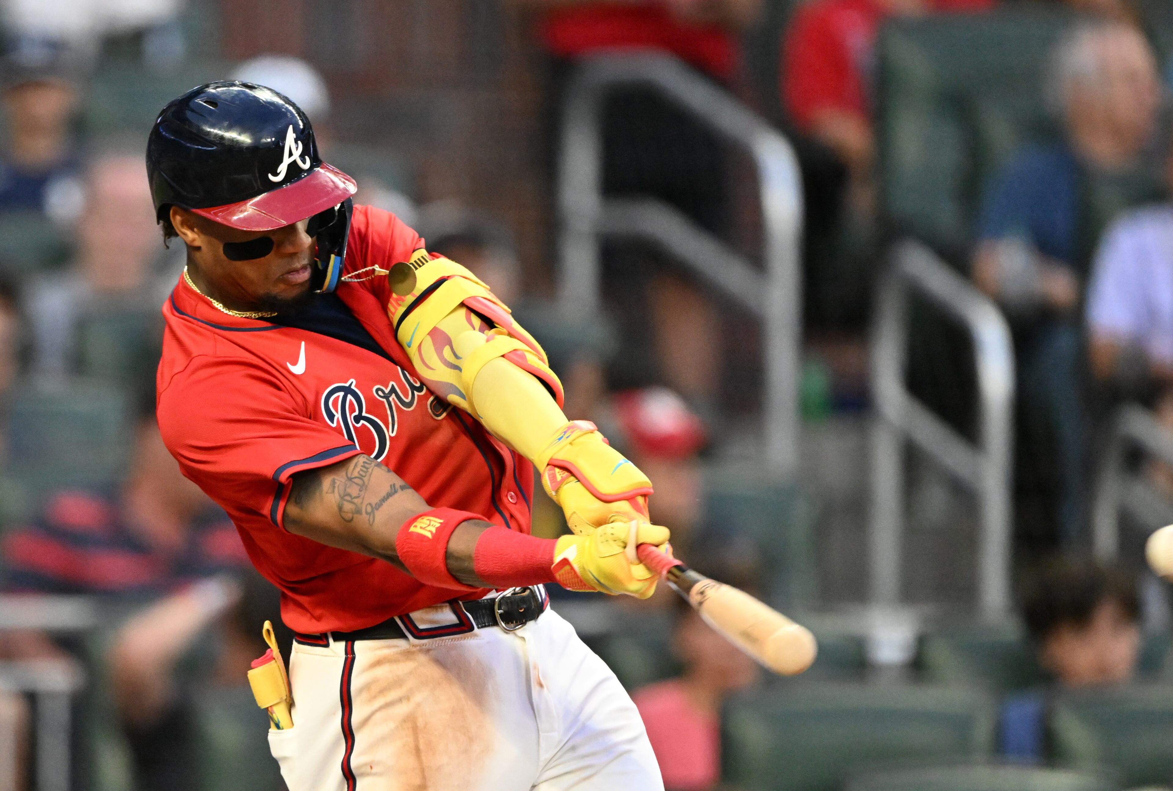 Atlanta Braves outfielder Ronald Acuña Jr. (13) hits a triple during the fourth inning of a baseball game at Truist Park, Friday, July 18, 2025, in Atlanta. Atlanta Braves won 7-3 over New York Yankees. (Hyosub Shin / AJC)