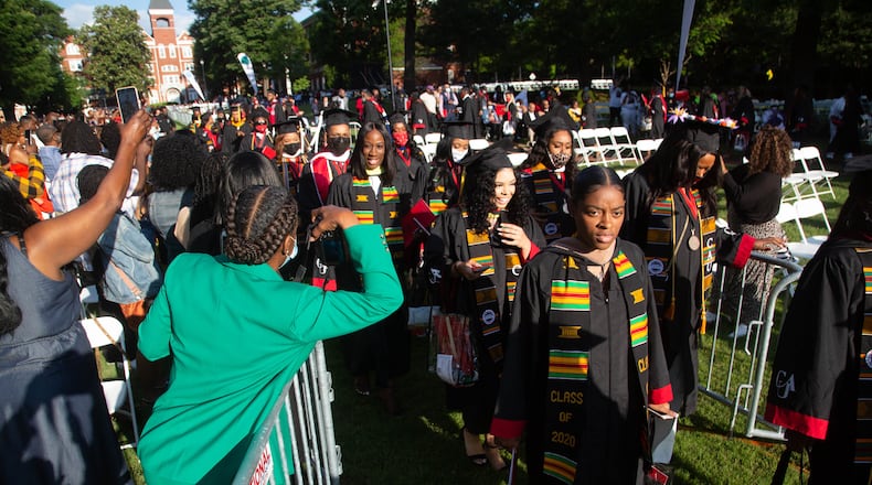 The 2020 Clark Atlanta University graduates head into Harkness Hall Quadrangle for their pandemic-belated graduation ceremony in Atlanta on Saturday, May 15, 2021. (Photo: Steve Schaefer for The Atlanta Journal-Constitution)