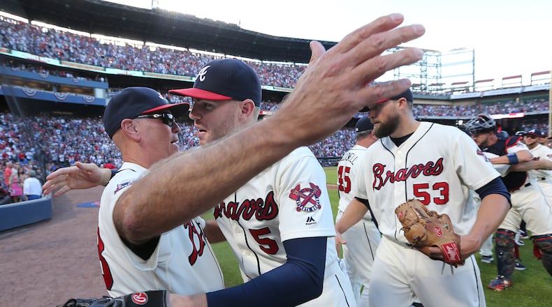 Braves manager Brian Snitker (left) and slugger Freddie Freeman say team isn’t panicking or losing confidence after 6-12 start. (Curtis Compton /ccompton@ajc.com)