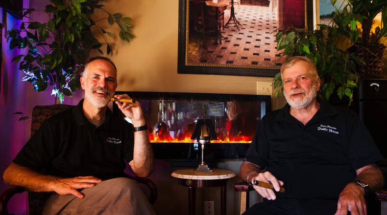 Rory Webb and Jeff Carey, owners of Stone Mountain Public House, pose for a portrait on Saturday, January 23, 2021, at Stone Mountain Public House in Stone Mountain, Georgia. Webb and Carey were forced to close Stone Mountain Public House due to the coronavirus pandemic, but are applying for a relief grant to help fund its reopening as a piano bar and cigar lounge. CHRISTINA MATACOTTA FOR THE ATLANTA JOURNAL-CONSTITUTION