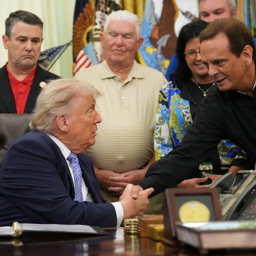 President Donald Trump, left, shakes the hand of Kevin McDaniel, Piggly Wiggly franchise owner, during an event about loosening a federal refrigerant rule, in the Oval Office at the White House, Thursday, May 21, 2026, in Washington. (AP Photo/Jacquelyn Martin)