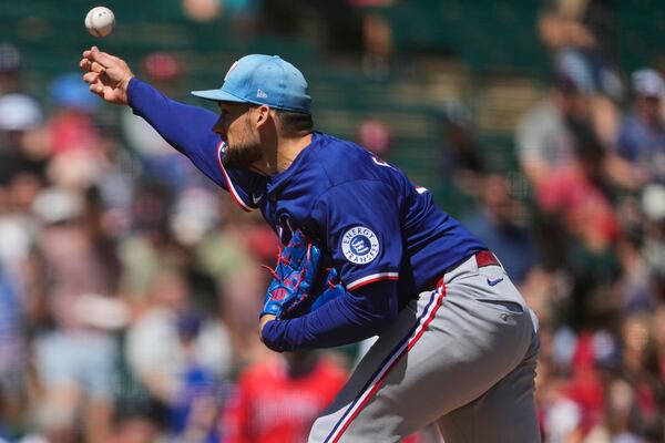 Texas Rangers pitcher Nathan Eovaldi throws against the Los Angeles Angels during the second inning of a spring training baseball game, Friday, March 21, 2025, in Tempe, Ariz. (AP Photo/Matt York)
