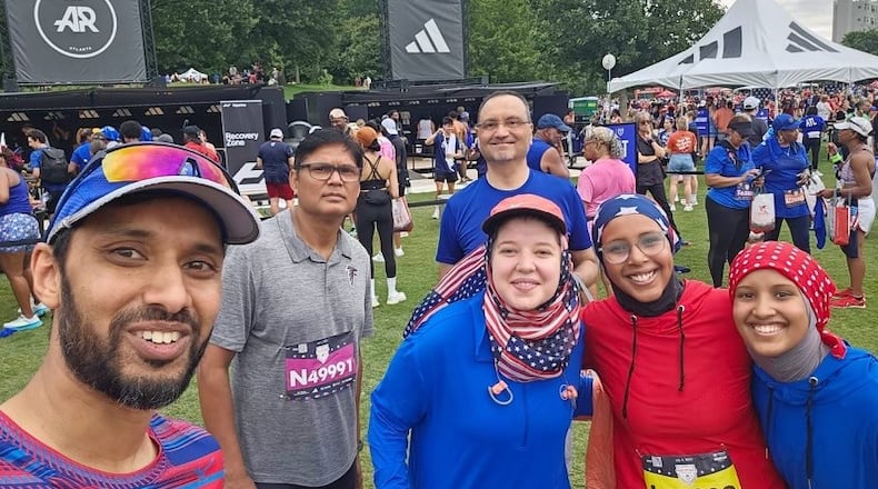 At last year’s Peachtree Road Race, members of the Atlanta Muslim Running Club met up after the race to celebrate. Left to right: Club founder Arif Kazi, Mohammad Khalid Akhtar, Ahmed Khan, Laila Kashlan, Yousra Mohamoud, and Karima Ahmed. The women’s combination of hijabs and patriotic colors got a lot of positive comments from many at the race. (Courtesy of Yousra Mohamoud)