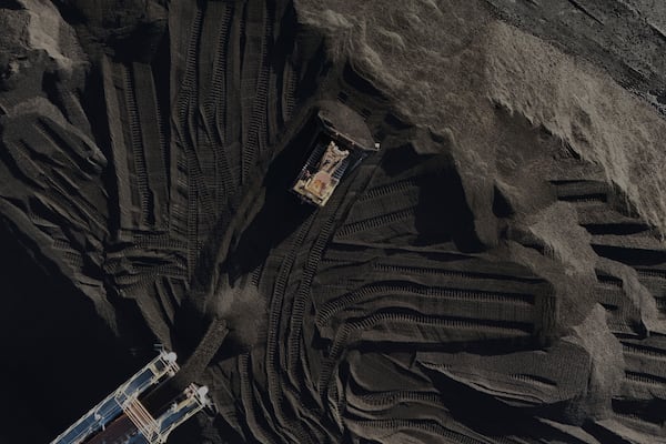 A bulldozer moves coal Thursday, April 10, 2025, in Princeton, Ind. (AP Photo/Joshua A. Bickel)