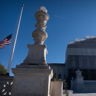 An American flag flies at half-staff outside the Supreme Court on Wednesday, Nov. 5, 2025, in Washington. (AP Photo/Mark Schiefelbein)