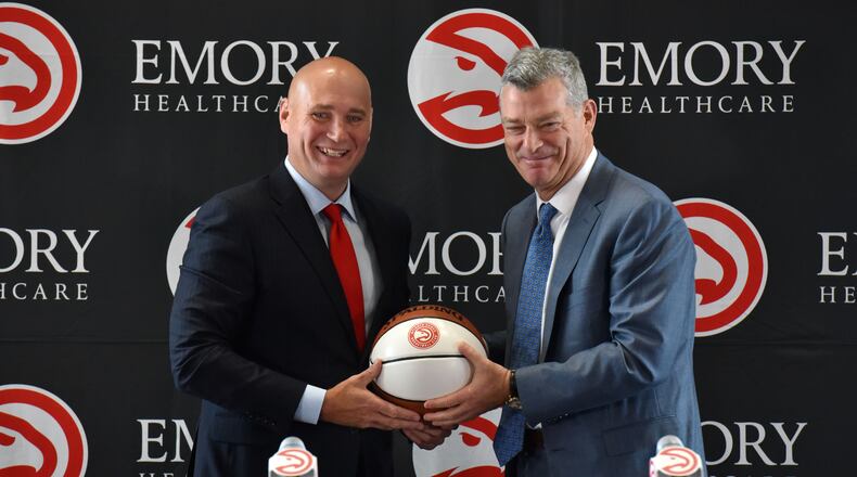 Hawks GM Travis Schlenk (left) and principal owner Tony Ressler at the news conference to introduce Schlenk on June 2, 2017. HYOSUB SHIN / HSHIN@AJC.COM