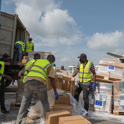 Workers offload medical and emergency supplies donated by European Union to support frontline workers in fighting Ebola upon arrival at the national airport in Bunia, Congo. Thursday, May 28, 2026. (AP Photo/Moses Sawasawa)