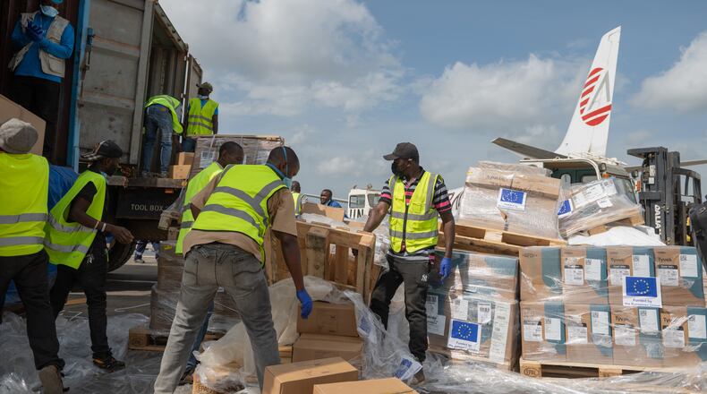 Workers offload medical and emergency supplies donated by European Union to support frontline workers in fighting Ebola upon arrival at the national airport in Bunia, Congo. Thursday, May 28, 2026. (AP Photo/Moses Sawasawa)