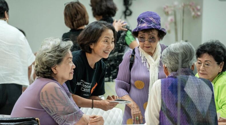 Kay Kang, outreach coordinator for Asian Americans Advancing Justice-Atlanta, speaks with the Korean Mothers Association of Atlanta in Suwanee on June 25, 2024. (Courtesy of Dean Hesse)