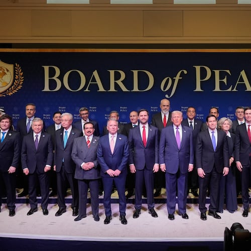 FILE - President Donald Trump stands with other World leaders before a Board of Peace meeting at the U.S. Institute of Peace, Feb. 19, 2026, in Washington. (AP Photo/Mark Schiefelbein, File)