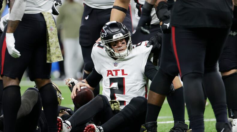 Atlanta Falcons quarterback Matt Ryan (2) sits on the turf after a sack against the New Orleans Saints during the second half of an NFL football game, Sunday, Nov. 7, 2021, in New Orleans. (AP Photo/Derick Hingle)