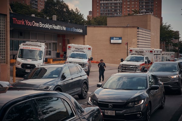 Ambulances are parked outside Brookdale University Hospital and Medical Center on Tuesday, July 1, 2025, in the Brooklyn borough of New York. (AP Photo/Andres Kudacki)