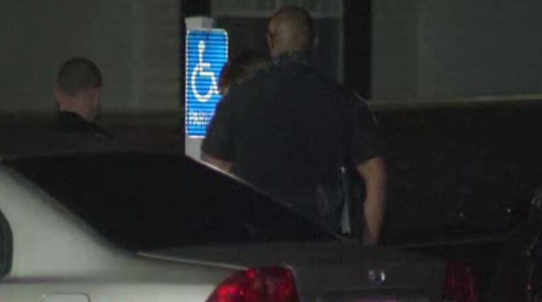 DeKalb County homicide detectives investigate at the Grovewood Park Apartments after a woman was shot and killed in the parking lot. She was found near her vehicle.