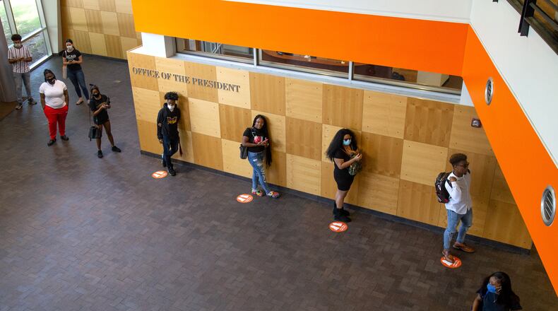 Clayton State University students line up to get their IDs on the first day students returned to school Monday August 10, 2020.  STEVE SCHAEFER FOR THE ATLANTA JOURNAL-CONSTITUTION