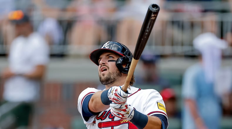 Atlanta Braves' Austin Riley follows through on a solo home run against the Texas Rangers during the second inning of a baseball game, Sunday, July 19, 2026, in Atlanta. (AP Photo/Erik S. Lesser)