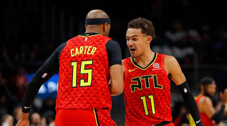Trae Young #11 of the Atlanta Hawks celebrates after a shot by Vince Carter #15 in the second half against the San Antonio Spurs.  (Photo by Kevin C. Cox/Getty Images)