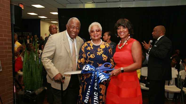 Baseball Hall of Famer Hank Aaron, his wife Billye Aaron and Morehouse School of Medicine President Valerie Montgomery Rice cut the ribbon at the opening of the Billye Suber Aaron Pavilion.