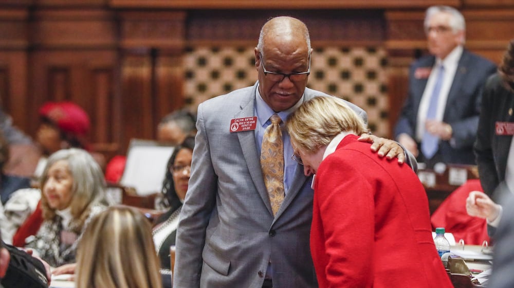 State Rep. Sharon Cooper (R-Marietta) is congratulated by Rep. Calvin Smyre, (D-Columbus), after the passage of a bill on reform of senior care in Georgia. Smyre spoke in support of the bill. The Georgia house passed HB 987, sponsored by Cooper, to provide additional measures for the protection of elderly persons and better regulate assisted living facilities and large personal care homes. Bob Andres / robert.andres@ajc.com