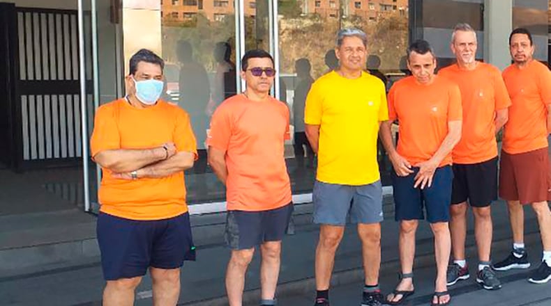 This undated file photo posted on Twitter last June by Venezuela's Foreign Minister Jorge Arreaza, shows CITGO oil executives Jose Angel Pereira, from left to right, Gustavo Cardenas, Jorge Toledo, Jose Luis Zambrano, Tomeu Vadell and Alirio Jose Zambrano, standing outside the Bolivarian National Intelligence Service, in Caracas, Venezuela. The oil executives jailed in Venezuela more than three years ago on corruption charges were granted house arrest on Friday in a gesture of goodwill toward the Biden administration as it reviews its policy toward the politically turbulent South American country.