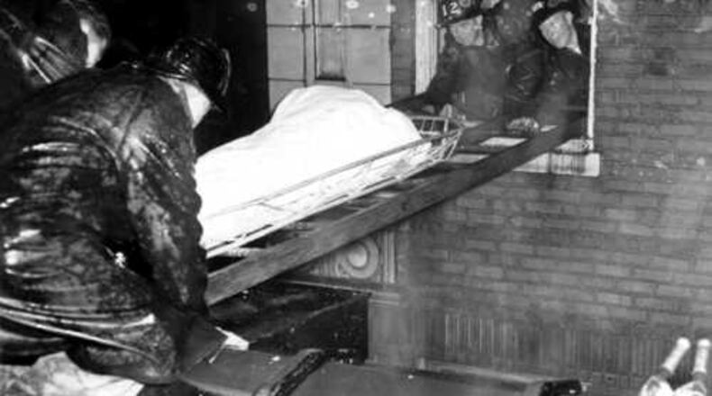 Atlanta firefighters remove bodies from the Winecoff Hotel on Dec. 7, 1946. The fire killed 119 people.