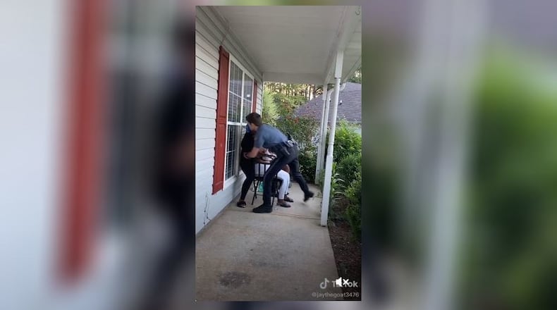 A Gwinnett County police officer has been placed on administrative duty pending an internal investigation into the arrest of a woman Tuesday on the front porch of a Loganville home.