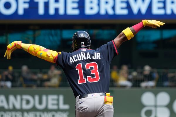 Atlanta Braves' Ronald Acuña Jr. (13) reacts after hitting a two-run home run during the fourth inning of a baseball game against the Milwaukee Brewers, Wednesday, June 11, 2025, in Milwaukee. (AP Photo/Kayla Wolf)