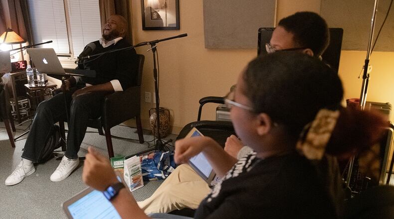 From left, Darius Hicks, host of the podcast “While Black,” interviews Harvard Debate Council Diversity Project alumni Xavier Shankle and Payton Gunner in Roswell, Ga., on Jan. 6, 2020. PHOTO BY ELISSA BENZIE for The Atlanta Journal-Constitution