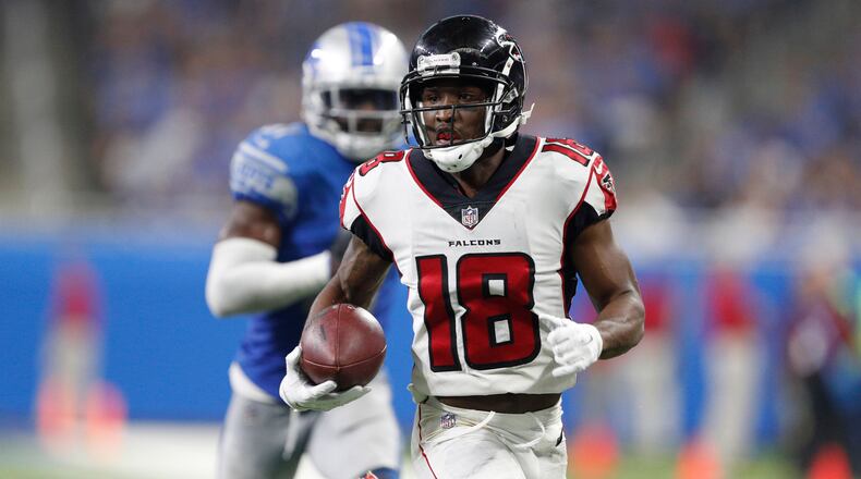 Atlanta Falcons wide receiver Taylor Gabriel (18) runs after a catch for a touchdown during the fourth quarter against the Detroit Lions at Ford Field.