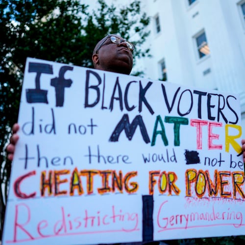 Travis Jackson, of Montgomery, stands during a press conference outside the Alabama state house during a special session of the Alabama Legislature, Tuesday, May 5, 2026, in Montgomery, Ala. (AP Photo/Mike Stewart)