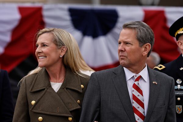 Gov. Brian Kemp and his wife Marty smile at supporters outside Georgia State University Convocation Center  following his inauguration on Thursday, January 12, 2023.  (Natrice Miller/natrice.miller@ajc.com)    